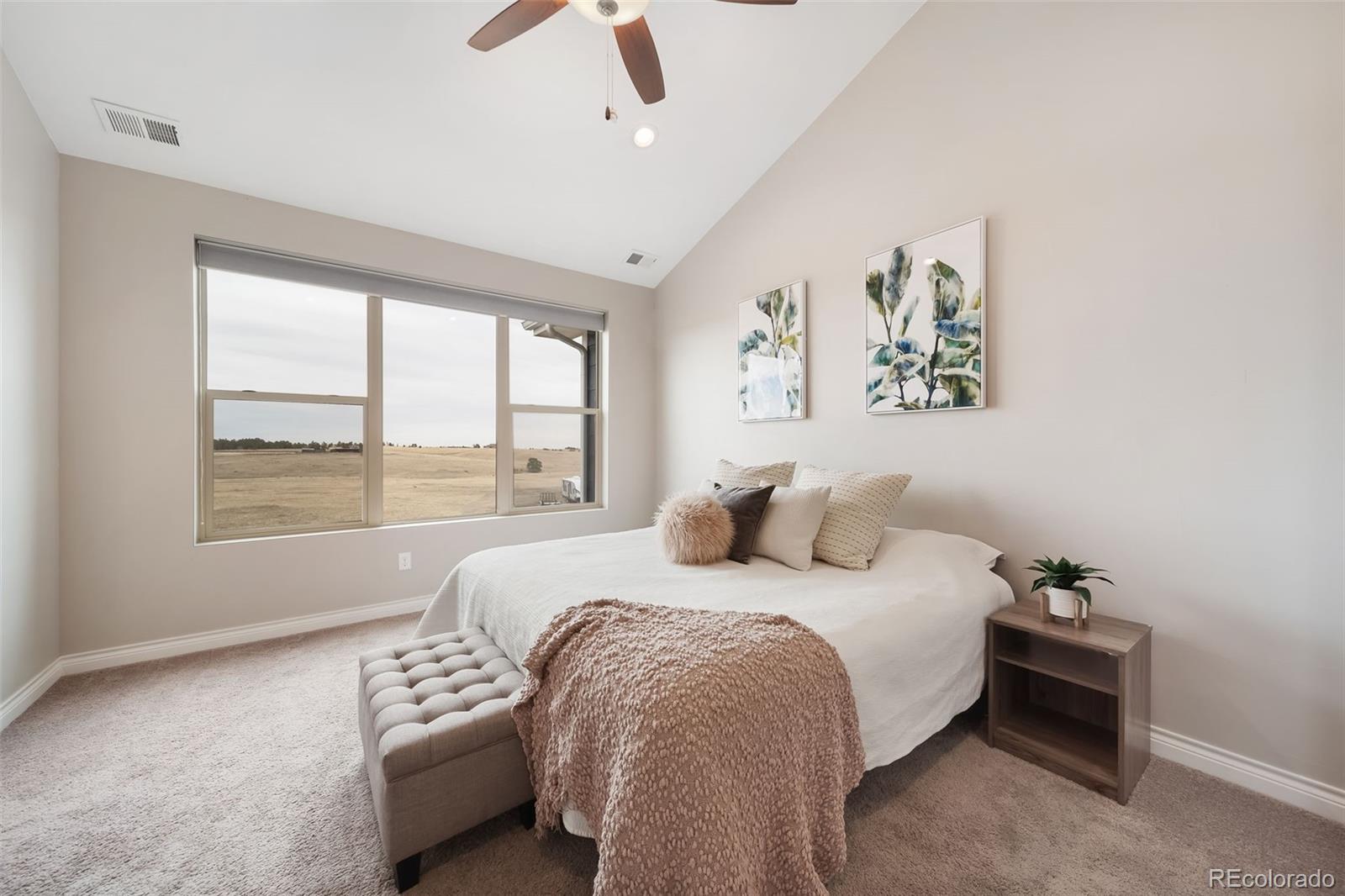 240 High Meadows Loop Elizabeth, CO 80107 - Photo 30 of 50 a bedroom with bed and a large window
