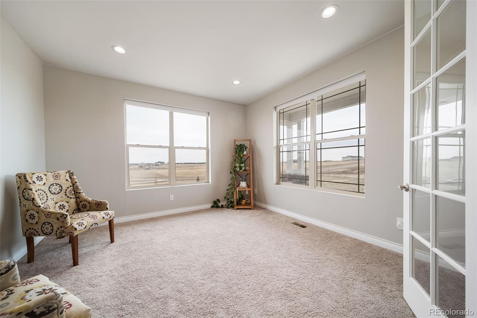 240 High Meadows Loop Elizabeth, CO 80107 - Photo 10 of 50 a living room with furniture and a window