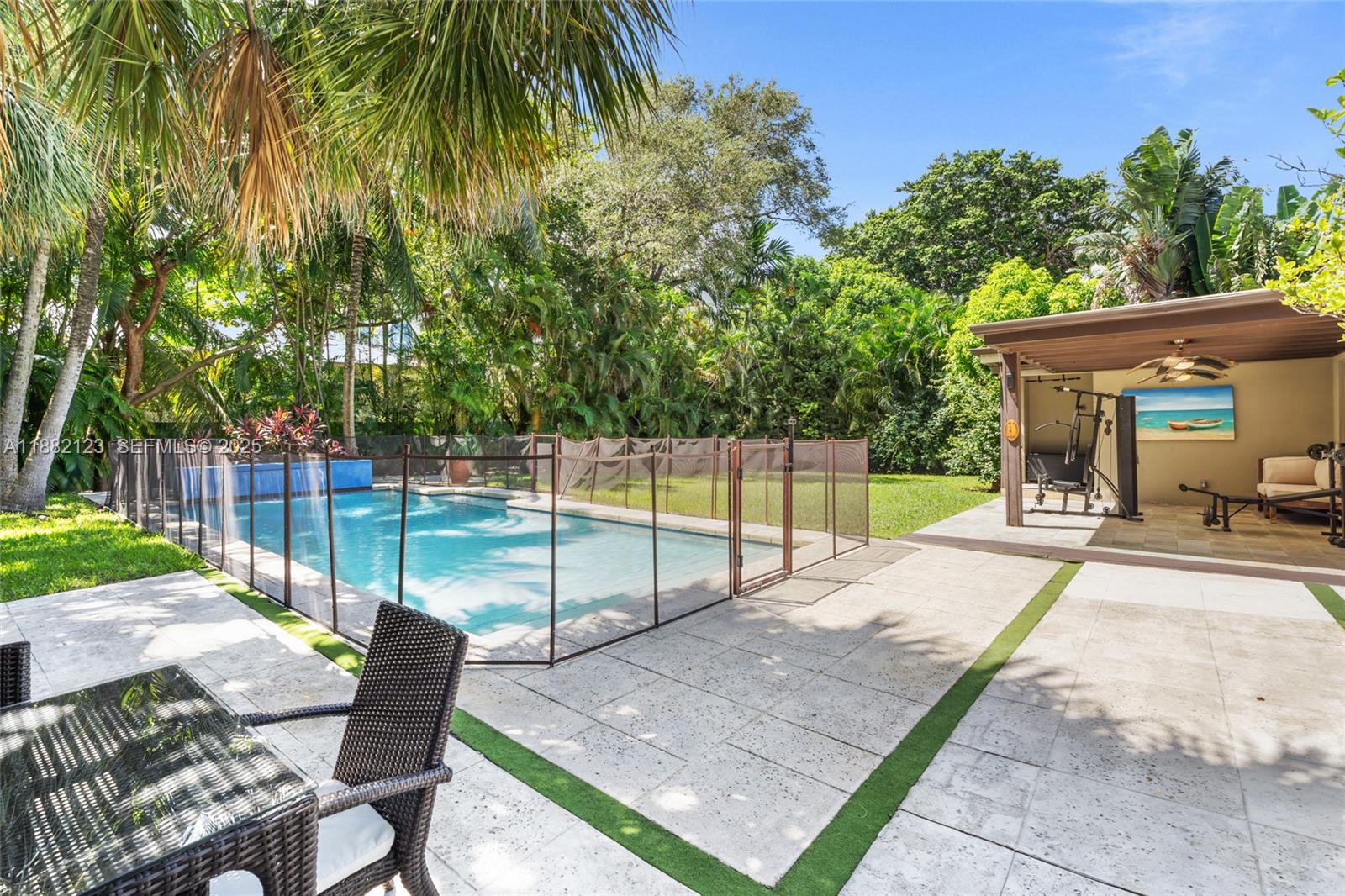 560 Sabal Palm Road Miami, FL 33137 - Photo 14 of 15 a view of a backyard with sitting area