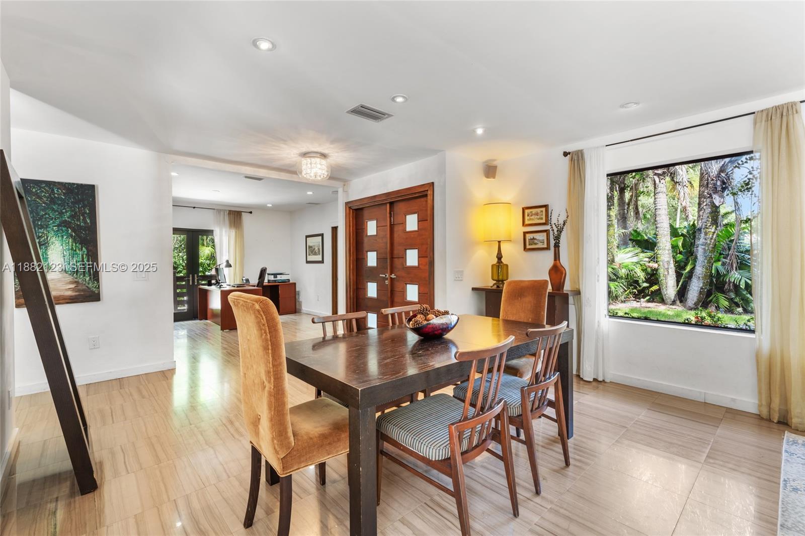 560 Sabal Palm Road Miami, FL 33137 - Photo 3 of 15 a view of a dining room with furniture window and wooden floor