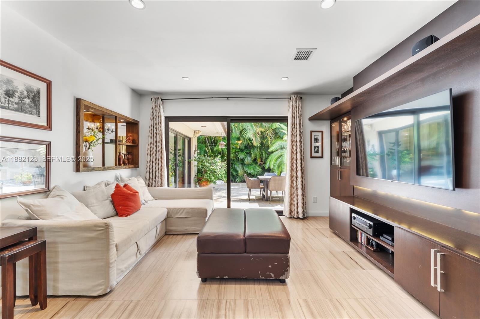 560 Sabal Palm Road Miami, FL 33137 - Photo 6 of 15 a living room with furniture and a large window