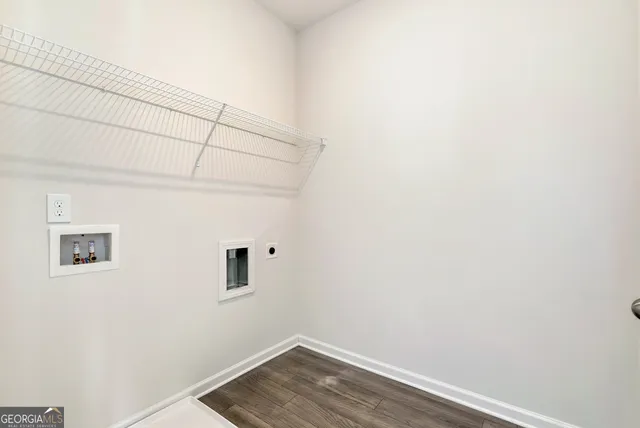 a view of a small space with wooden floor