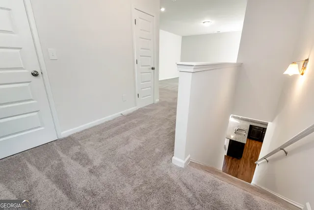 a view of a livingroom with a refrigerator