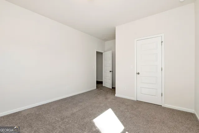 a view of a small space with wooden floor