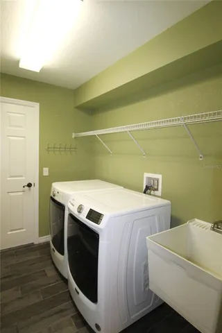 a utility room with washer and dryer