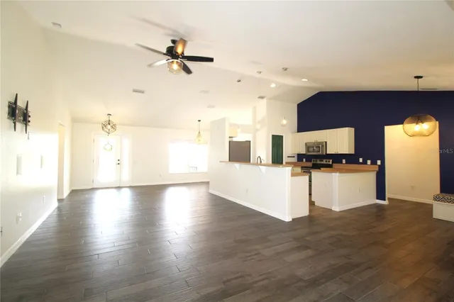 a view of a kitchen with microwave and cabinets