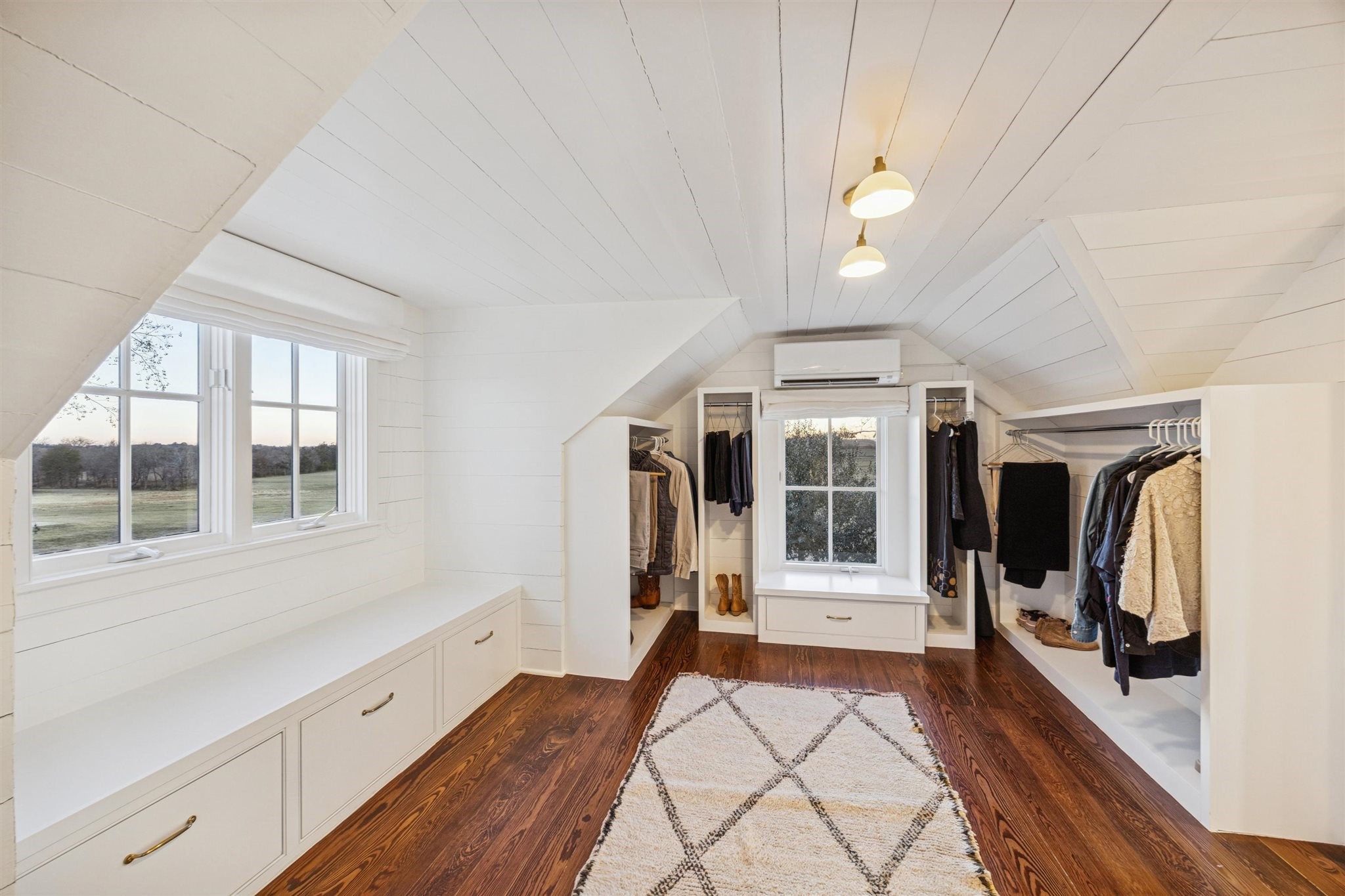 6389 Miller Road New Ulm, TX 78950 - Photo 18 of 49 a hallway with windows and chandelier