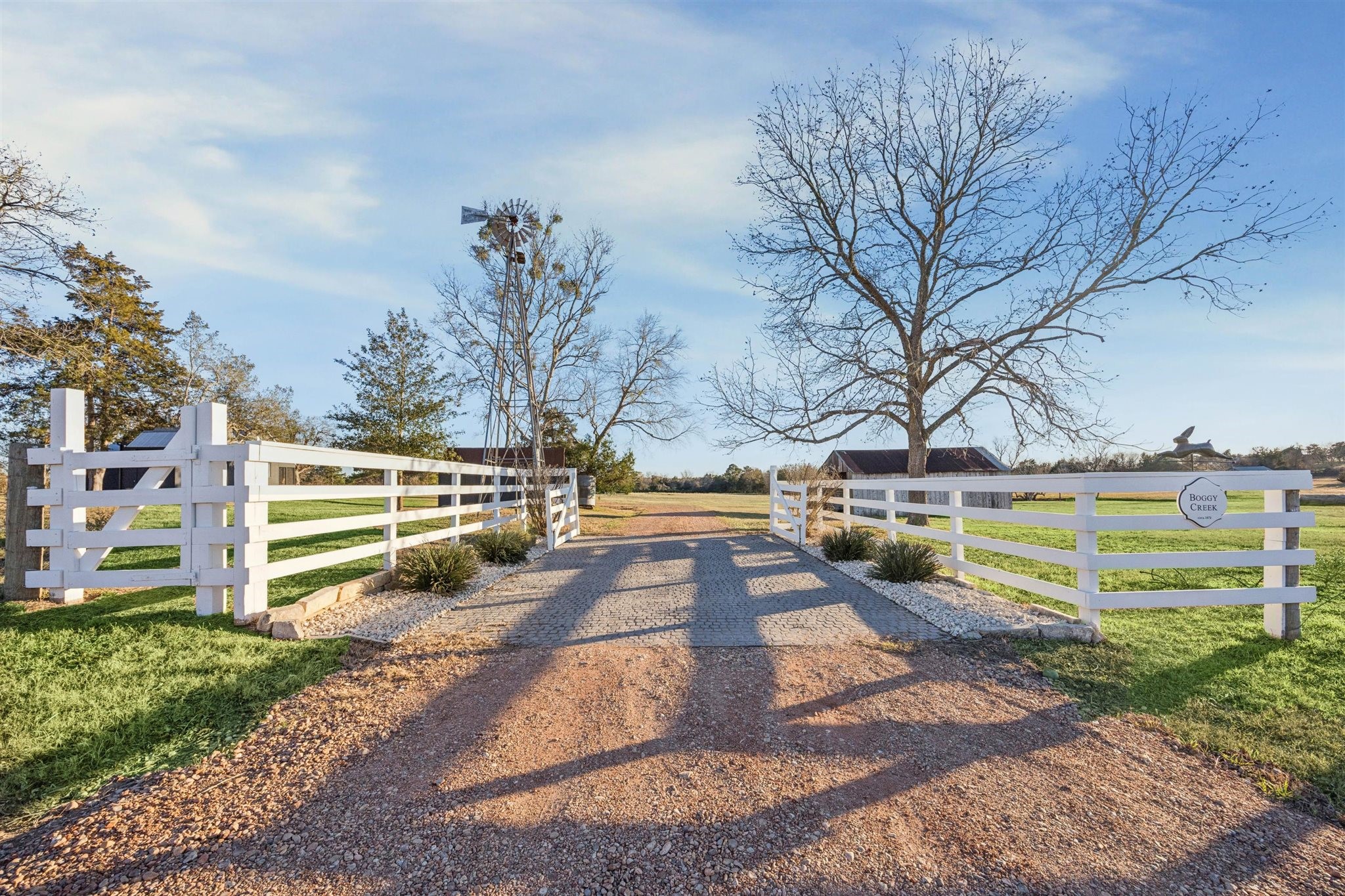 6389 Miller Road New Ulm, TX 78950 - Photo 2 of 49 a view of a yard with swimming pool in front of the house