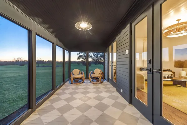 a view of a garden with lawn chairs