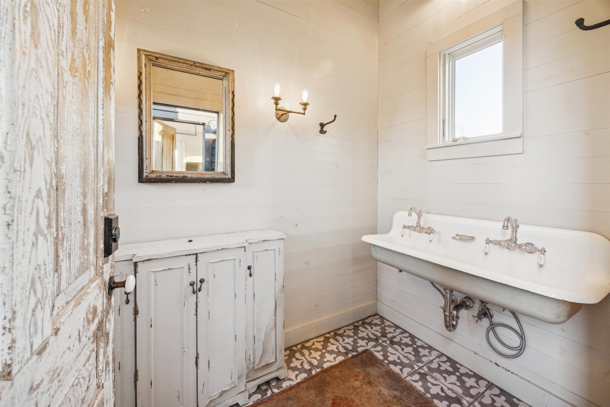 6389 Miller Road New Ulm, TX 78950 - Photo 33 of 49 a bathroom with a sink and a mirror