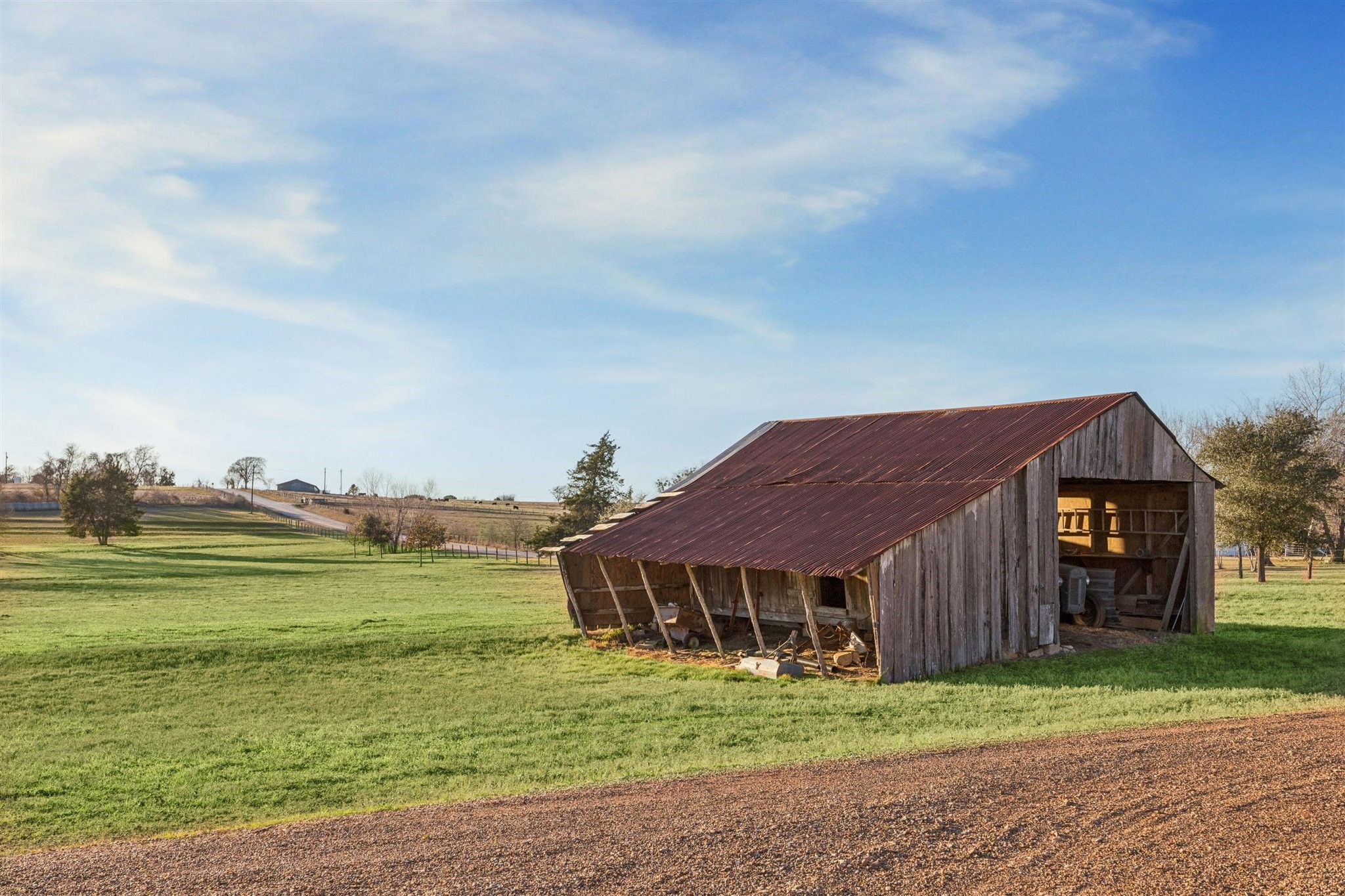 6389 Miller Road New Ulm, TX 78950 - Photo 43 of 49 a view of a big house with a big yard and large trees