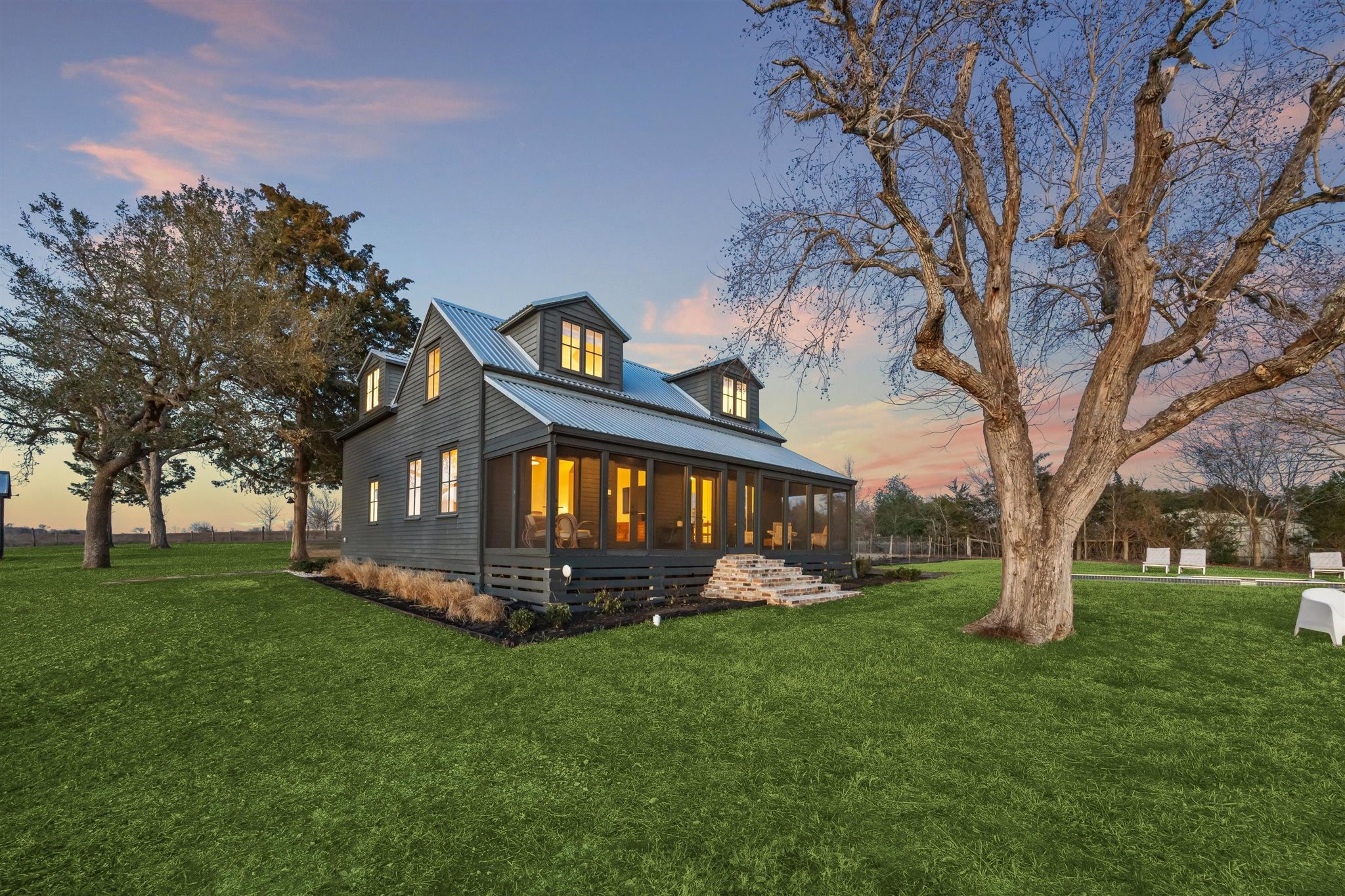 6389 Miller Road New Ulm, TX 78950 - Photo 47 of 49 a front view of a house with a garden