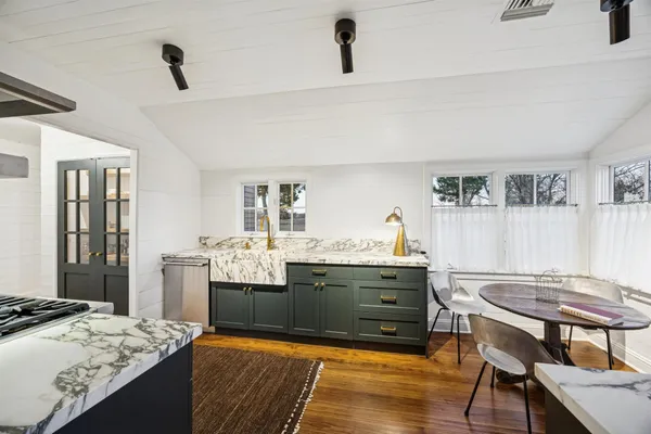 a living room with granite countertop furniture and a table