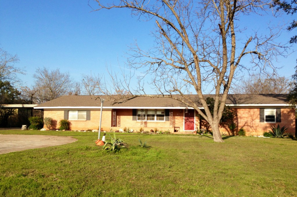 5716 Westview Road Austin, TX 78749 - Photo 1 of 1 a front view of a house with garden