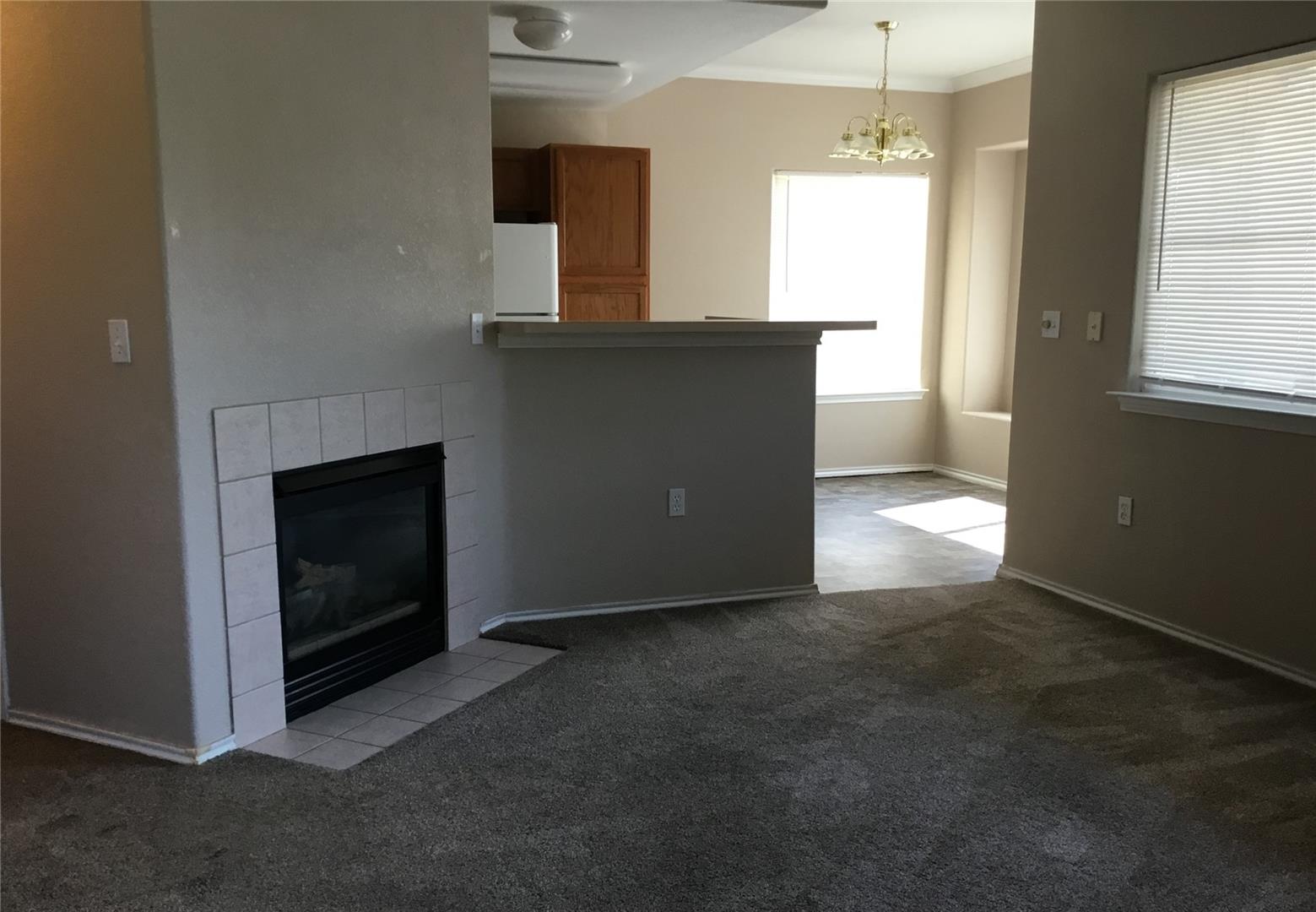3896 Riviera Grove, Unit 101 Colorado Springs, CO 80922 - Photo 4 of 7 Living room looking toward dining room