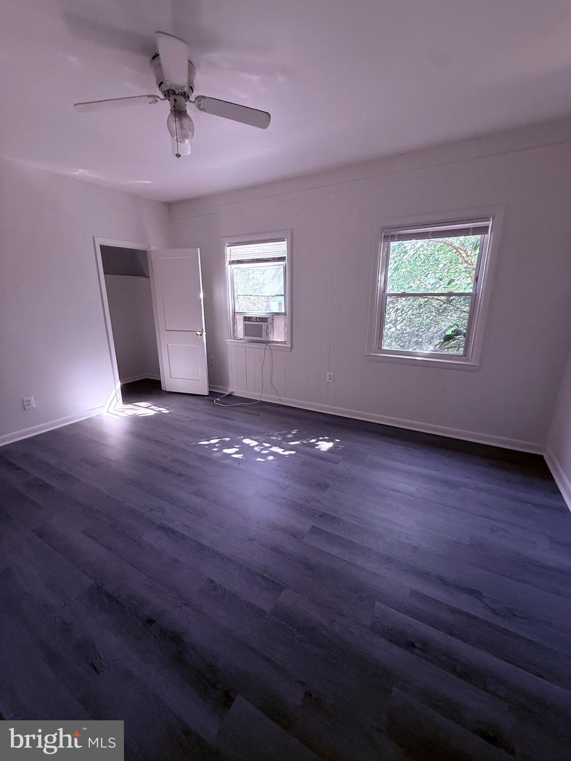 520 Baltic Avenue, Unit B Brooklyn, MD 21225 - Photo 5 of 11 a view of room with window and wooden floor