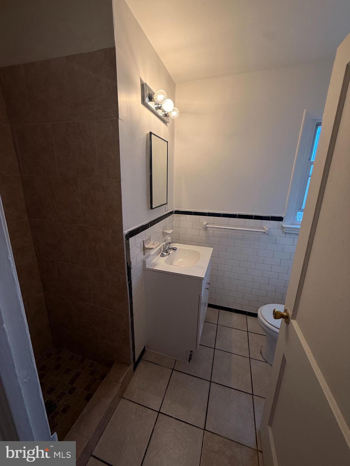 520 Baltic Avenue, Unit B Brooklyn, MD 21225 - Photo 9 of 11 a bathroom with a sink and mirror