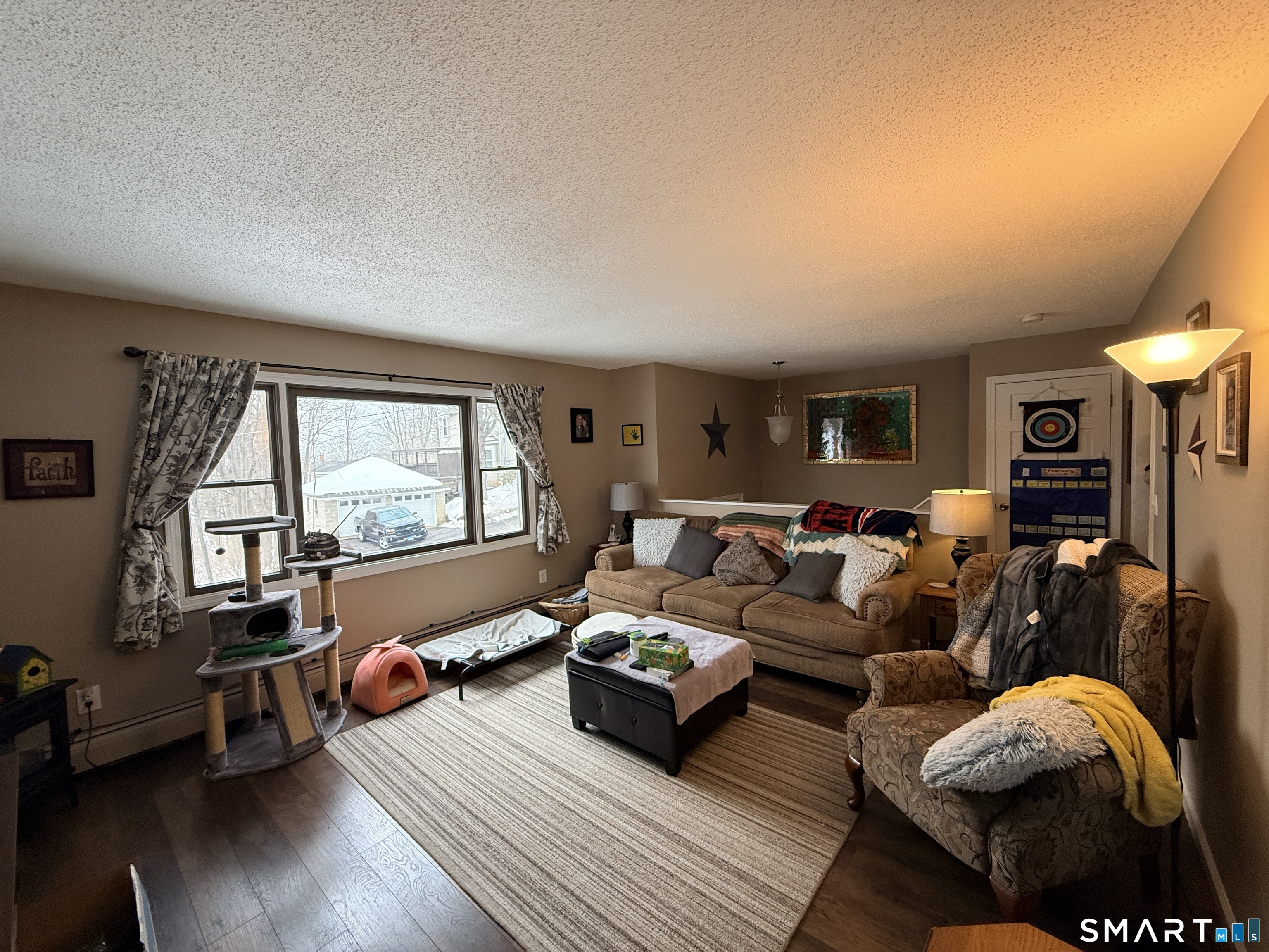 44 Lewis Street Winchester, CT 06098 - Photo 11 of 25 a living room with furniture and a window