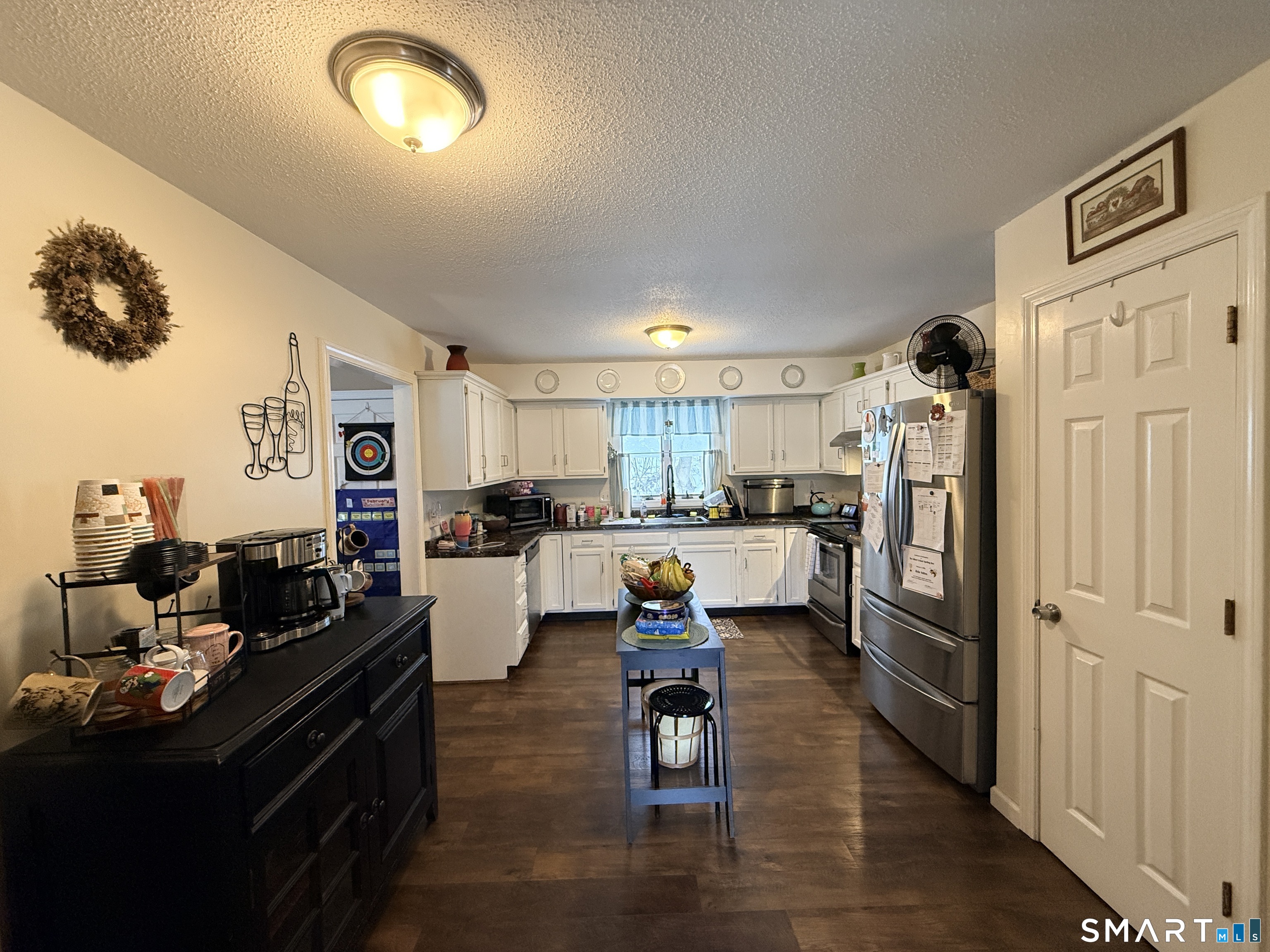 44 Lewis Street Winchester, CT 06098 - Photo 14 of 25 a kitchen with a refrigerator and a stove