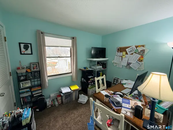 a room with furniture and a window