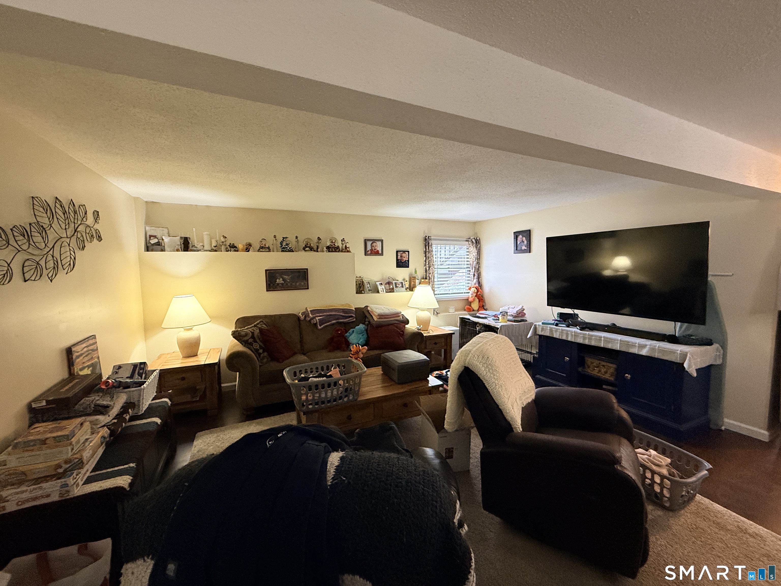 44 Lewis Street Winchester, CT 06098 - Photo 25 of 25 a living room with furniture and a flat screen tv