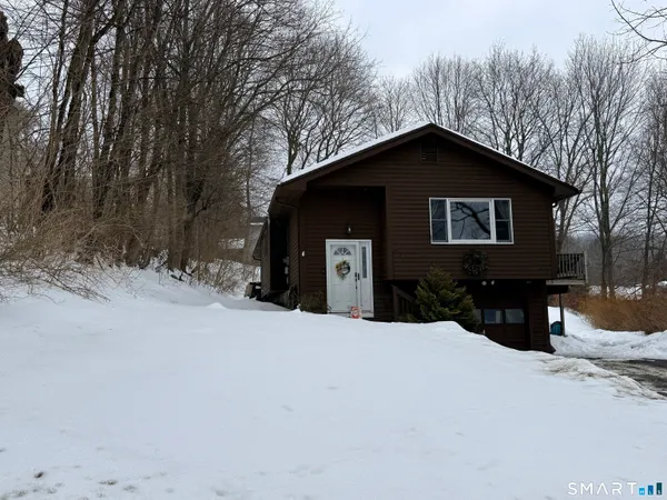 a house with trees in the background