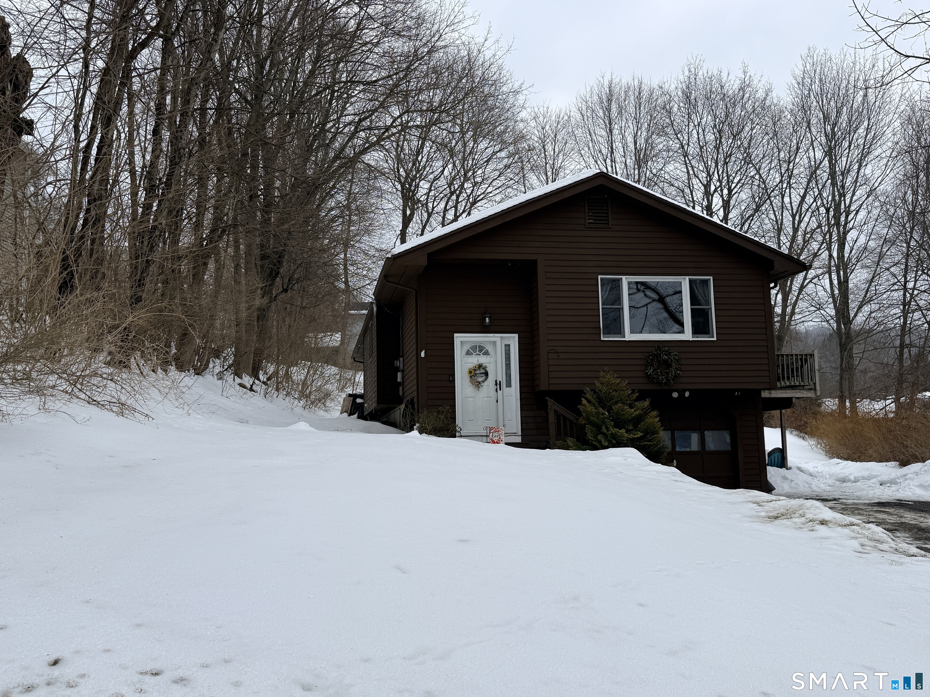 44 Lewis Street Winchester, CT 06098 - Photo 3 of 25 a house with trees in the background