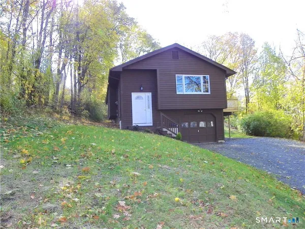 a house view with a garden space
