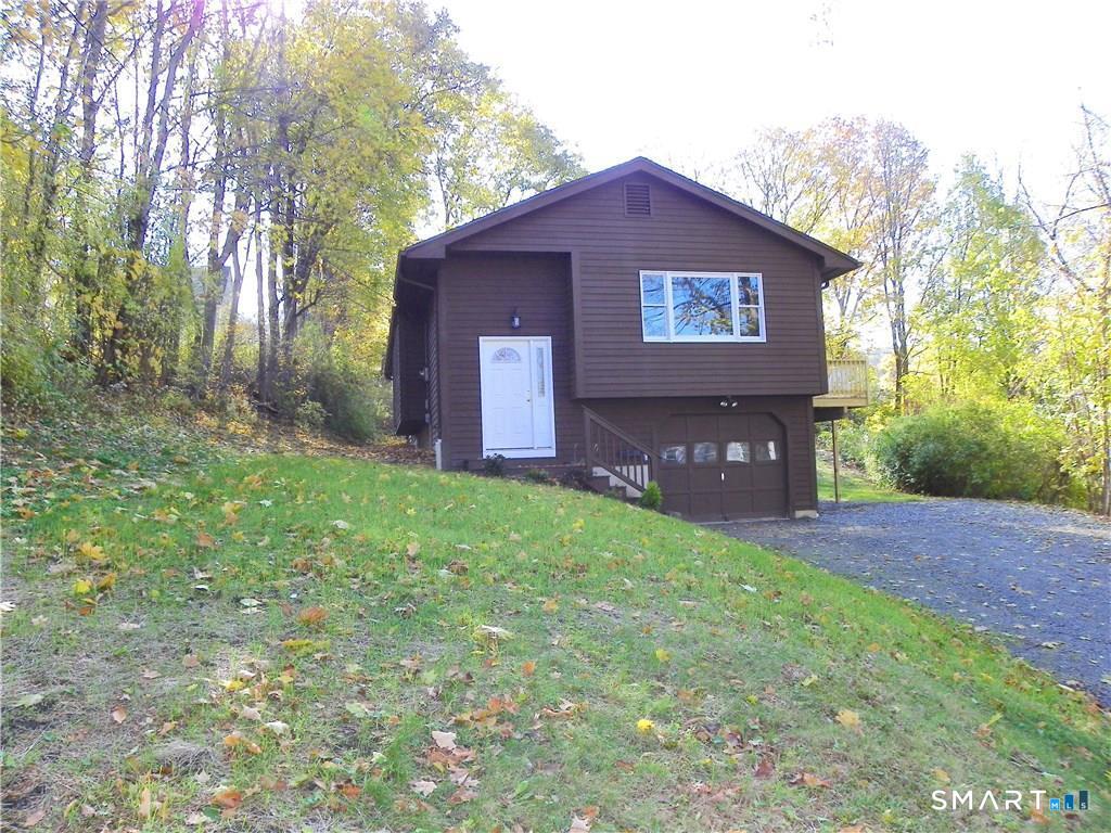 44 Lewis Street Winchester, CT 06098 - Photo 4 of 25 a house view with a garden space