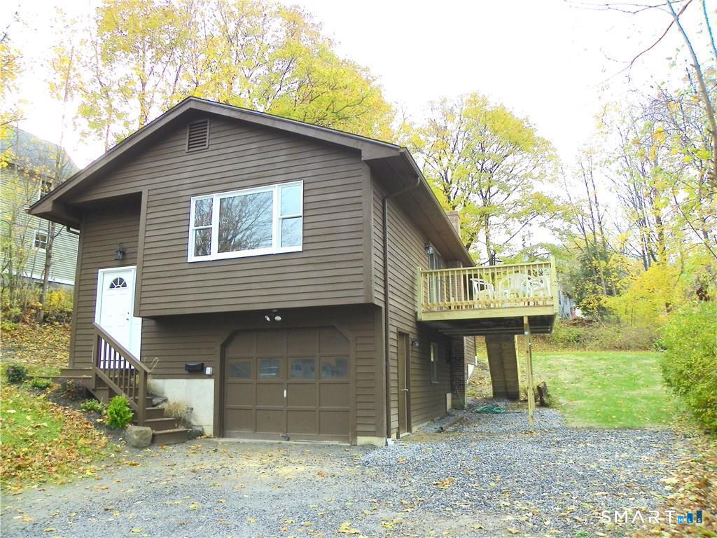 44 Lewis Street Winchester, CT 06098 - Photo 6 of 25 a front view of a house with a yard
