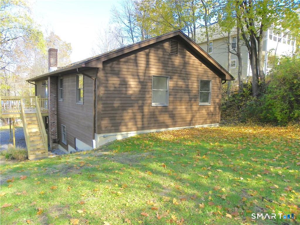 44 Lewis Street Winchester, CT 06098 - Photo 8 of 25 a view of backyard of house with green space