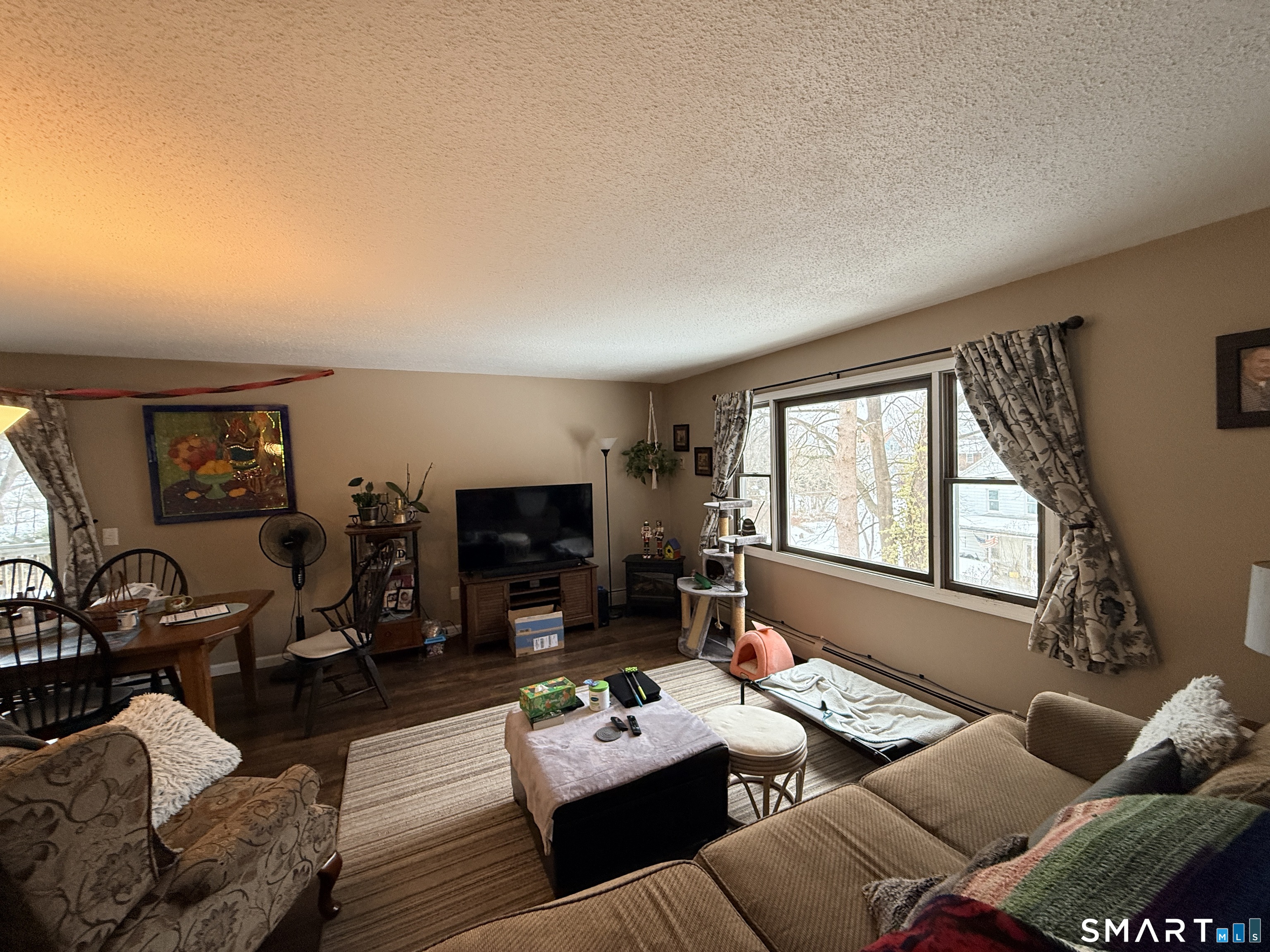 44 Lewis Street Winchester, CT 06098 - Photo 9 of 25 a living room with furniture a flat screen tv and a window
