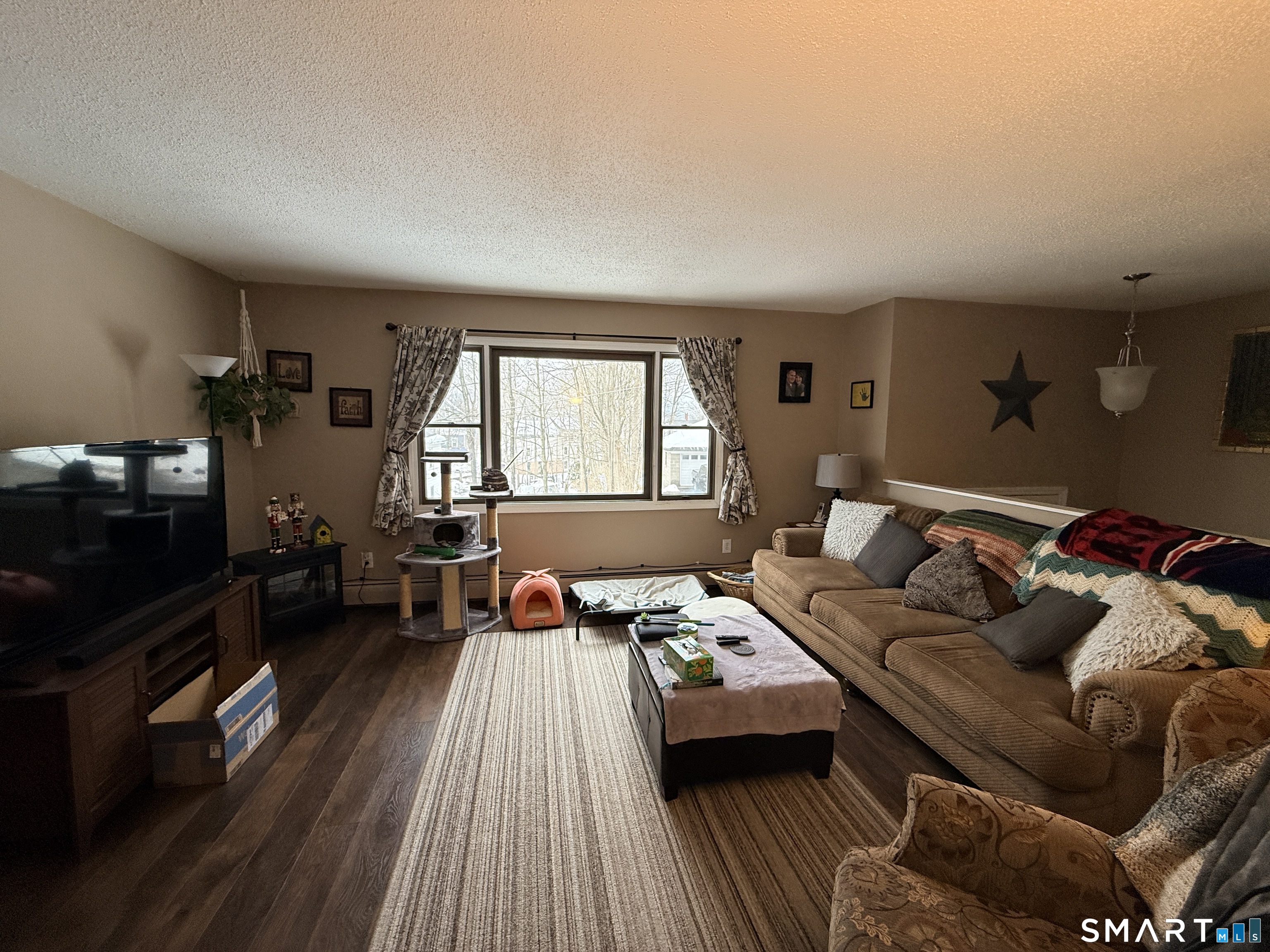 44 Lewis Street Winchester, CT 06098 - Photo 10 of 25 a living room with furniture and a flat screen tv
