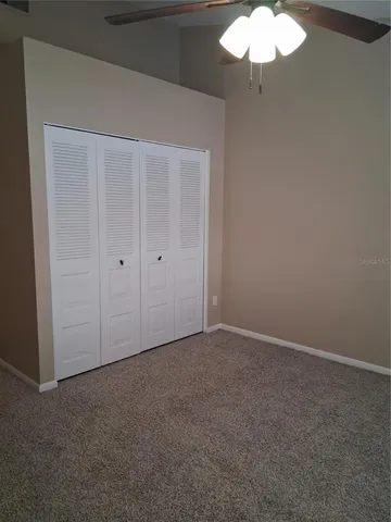 an empty room with a mirror