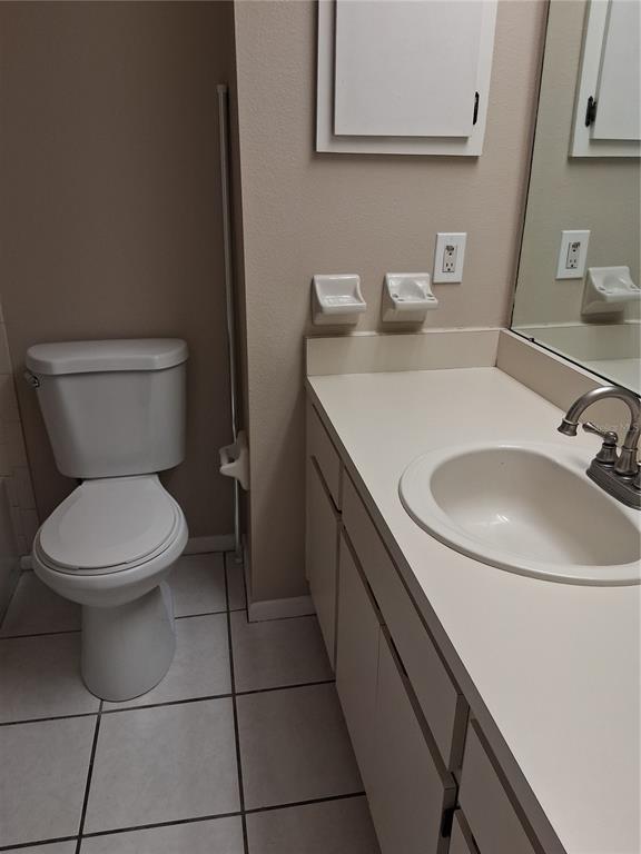 6710 121st Avenue, Unit 10 Largo, FL 33773 - Photo 13 of 17 a bathroom with a toilet sink and mirror