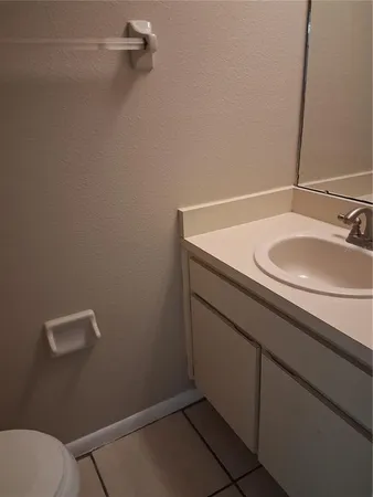 a bathroom with a sink and vanity