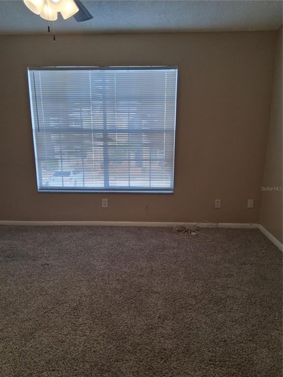 6710 121st Avenue, Unit 10 Largo, FL 33773 - Photo 17 of 17 an empty room with a empty space and a window