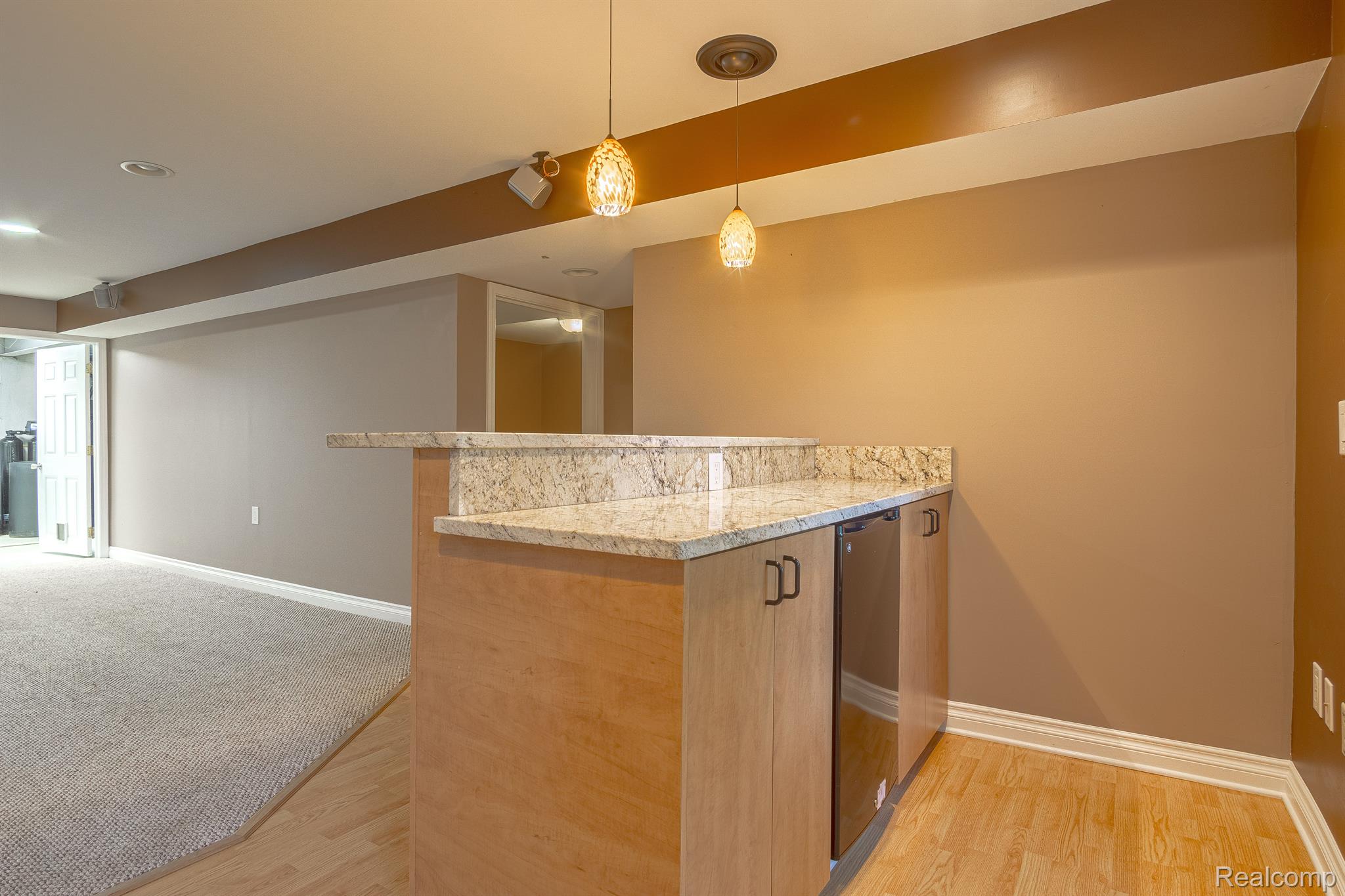 3930 Cullen Road Howell, MI 48855 - Photo 56 of 61 finished walkout lower level with bar