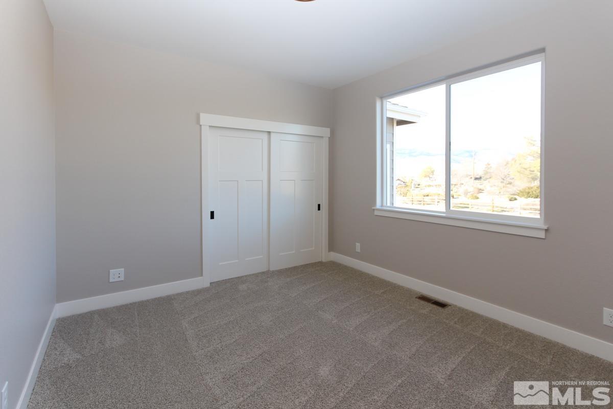 5077 Conte Drive Carson City, NV 89701 - Photo 30 of 40 an empty room with a window