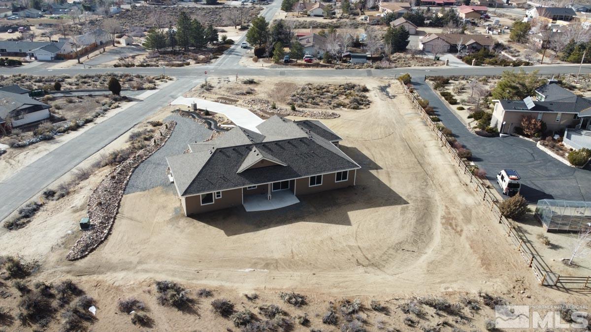 5077 Conte Drive Carson City, NV 89701 - Photo 36 of 40 a view of roof yard with wooden fence
