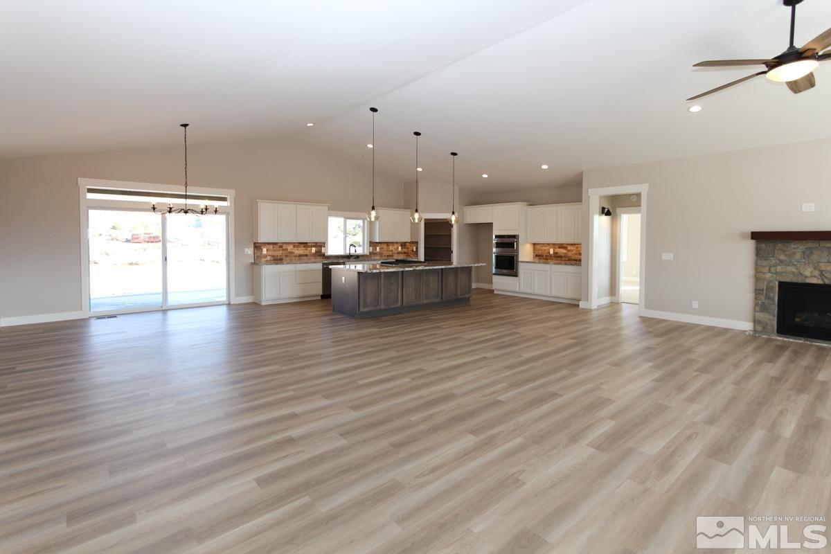 5077 Conte Drive Carson City, NV 89701 - Photo 6 of 40 a living room with furniture and a fireplace