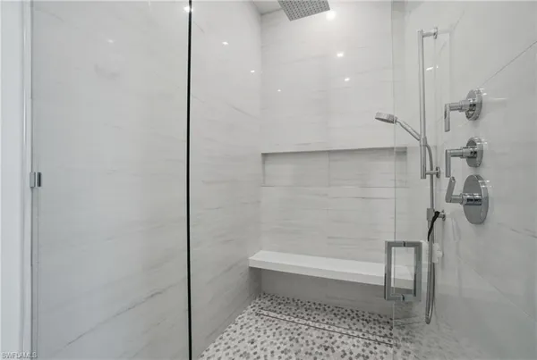 a bathroom with a shower and a toilet