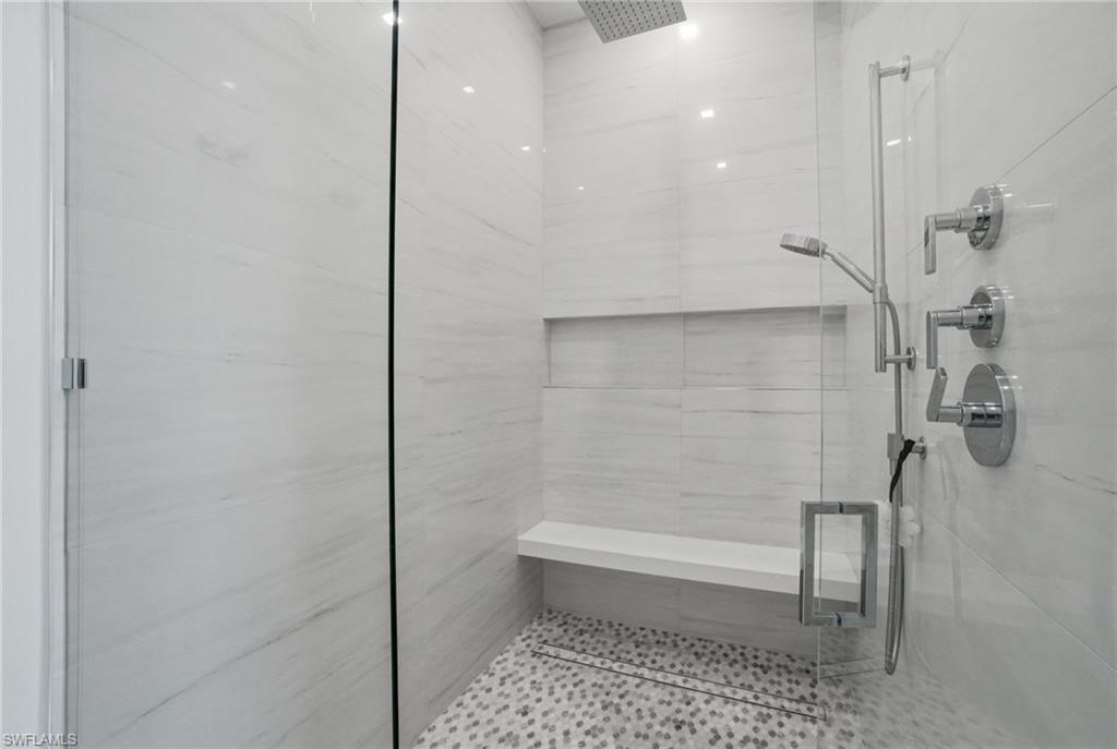264 8th Avenue South Naples, FL 34102 - Photo 13 of 40 a bathroom with a shower and a toilet