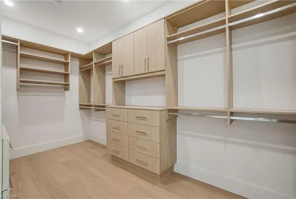 a view of an empty walk in closet