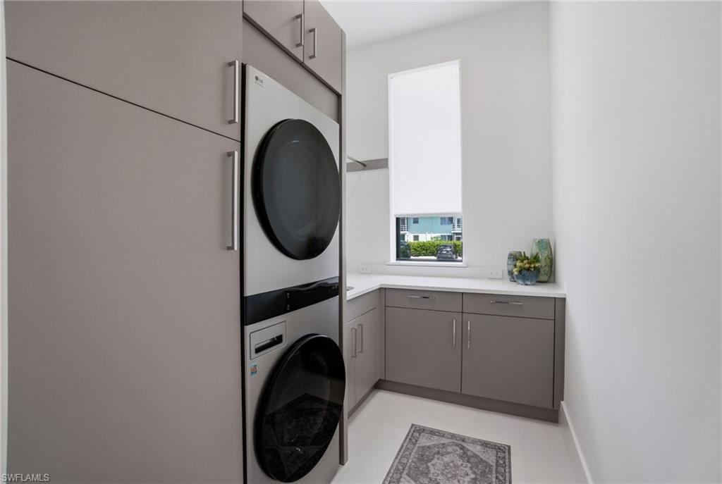 264 8th Avenue South Naples, FL 34102 - Photo 17 of 40 a utility room with sink dryer and washer