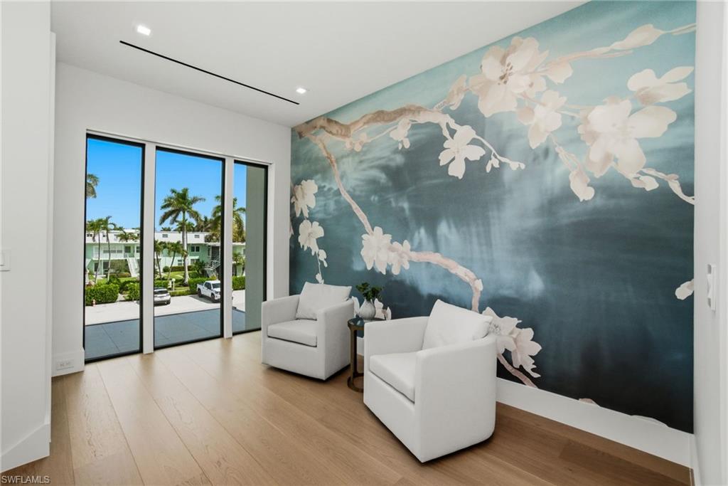 264 8th Avenue South Naples, FL 34102 - Photo 19 of 40 a living room with furniture and wooden floor