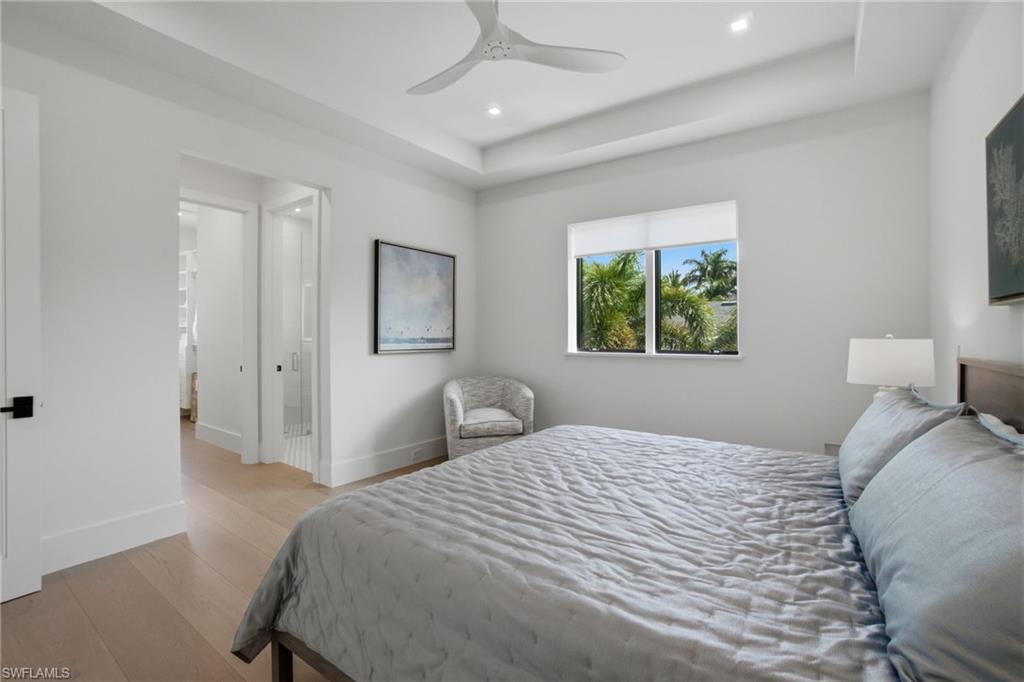264 8th Avenue South Naples, FL 34102 - Photo 20 of 40 a bedroom with a bed and a window