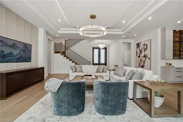 a living room with fireplace furniture and a flat screen tv