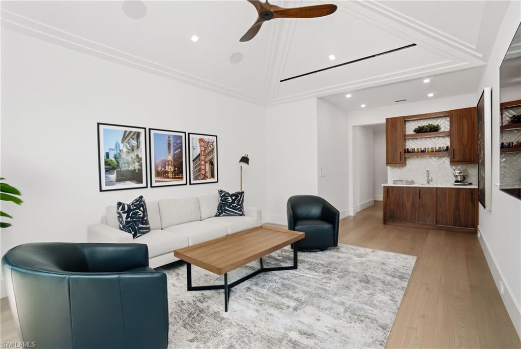 264 8th Avenue South Naples, FL 34102 - Photo 27 of 40 a living room with furniture and a couch