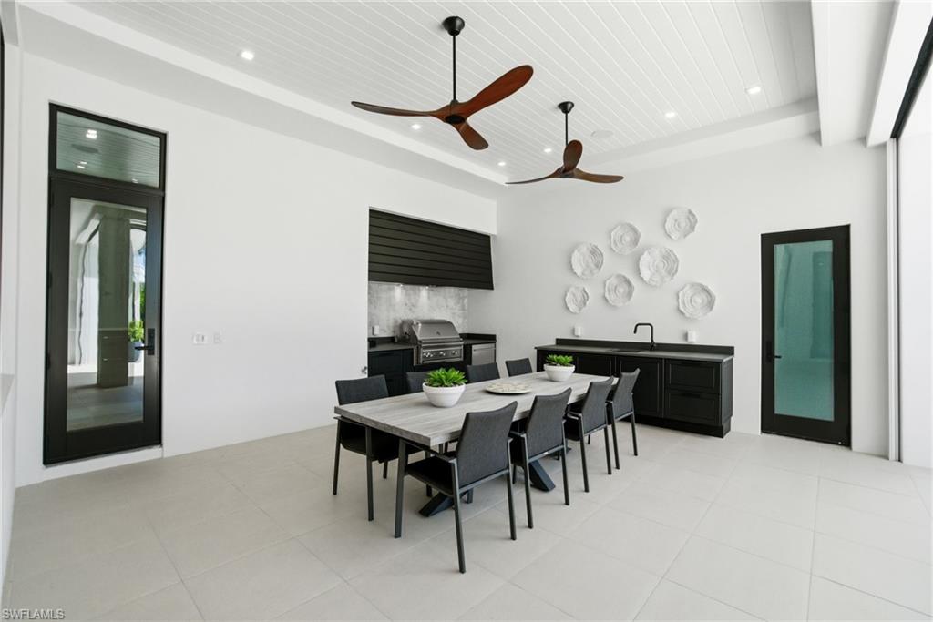 264 8th Avenue South Naples, FL 34102 - Photo 32 of 40 a view of a dining room with furniture